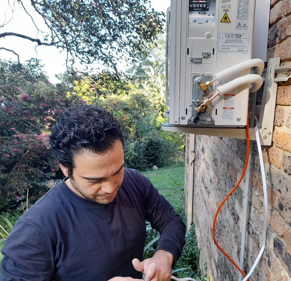 HVAC technician completing an air conditioning installation